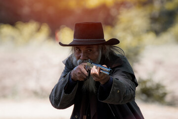cowboy with gun.portrait cowboy cowboy with gun prepares to gun fight.