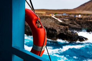 orange lifebuoy near the atlantic ocean