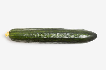 Single green long Chinese cucumber flat lay, isolated. on white background