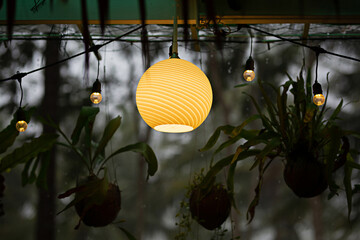 Yellow round electric lamp with eaves background