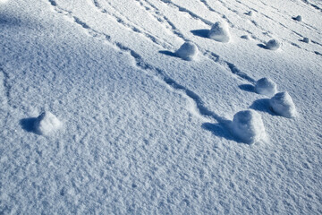 soft snow surface patterns in winter on hillside - Powered by Adobe