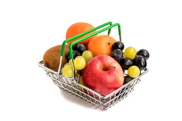 In a trading metal basket, a set of fresh healthy fruits - apple, grapes, tangerines, kiwi, blueberries. Delicious food for a healthy diet. 