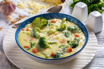 Broccoli cheese soup in a bowl, top view