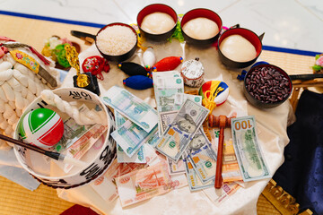 money on the table with decoration and accessories for Doljanchi.