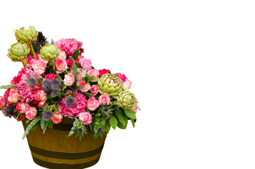 bouquet of flowers in a wooden bucket