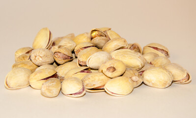 a handful of pistachios on a white background