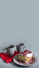 two grey cups and a pie on the table