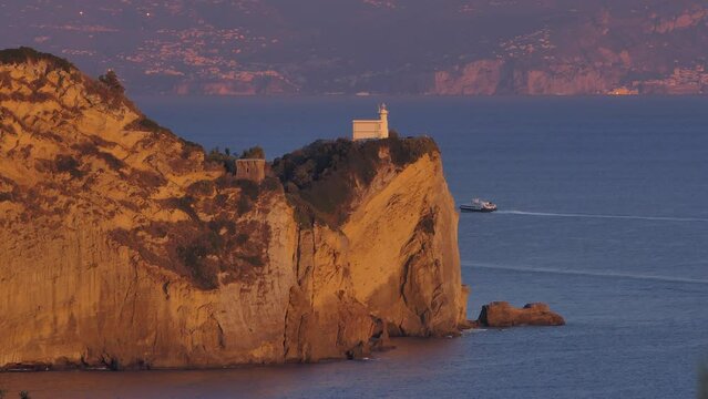 Italy, Bacoli, Capo Miseno lighthouse at sunset
