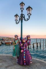 Colorful carnival masks at a traditional festival in Venice, Italy - 487754578