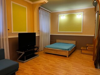 interior of a bedroom with bed and sofa