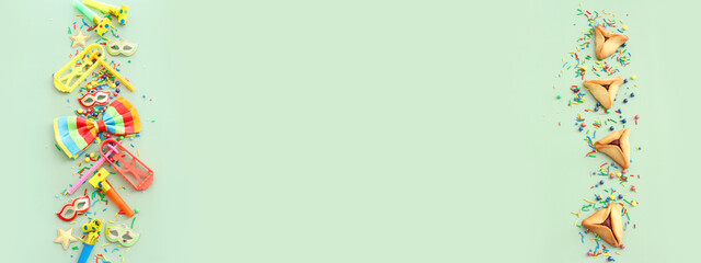 Purim celebration concept (jewish carnival holiday) over green background. Top view, flat lay