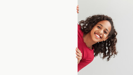 African Preteen Girl Posing With Blank White Board, Gray Background