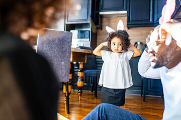 happy afro american people in bunny ears celebrate in modern big cozy house