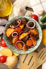 Concept of tasty food with beef with vegetables, top view
