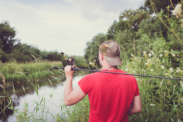 Fisherman with a spinning rod.