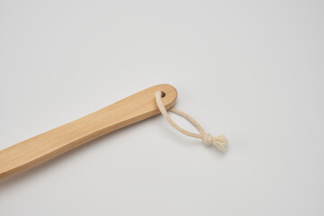 dry brush massager with natural bristles on a white background