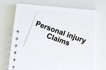 PERSONAL INJURY CLAIMS text on white paper