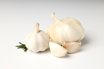 Garlic with rosemary on white background, close up