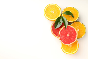 Concept of tasty food with citrus fruits on white background
