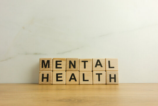 Words mental health from wooden cubes