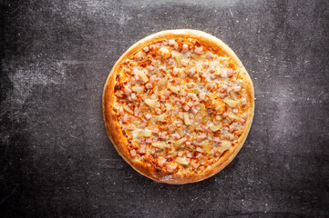 Pizza on a gray dark background top view
