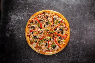 Pizza on a gray dark background top view