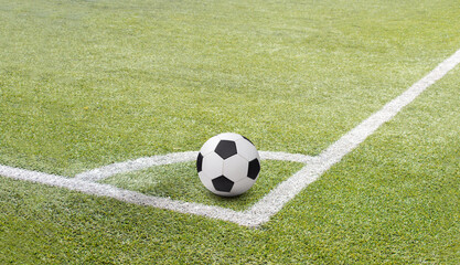Fototapeta na wymiar Soccer football on corner kick line of ball and a soccer field with background texture