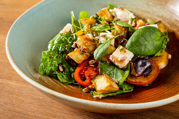 greek salad on the wooden background