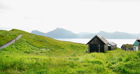 Panoramic view of typical houses of Gjogv village. Eysturoy island, Faroe Islands, Denmark.