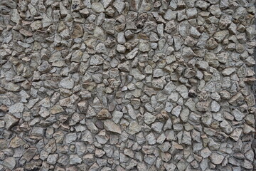 Backdrop - wall with light gray gravel pebble dash
