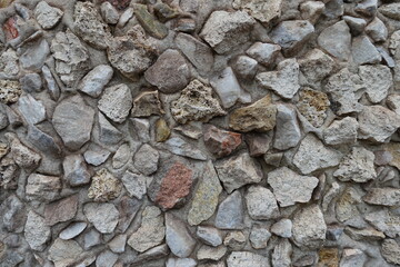 Close view of wall with gravel pebble dash in shades of gray