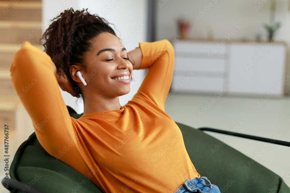 Canvas Prints calm black woman having rest at home on bean bag