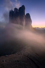 Tre Cime di Lavaredo is also called Drei Zinnen, these impressive mountain peaks are located in South Tyrol in the Italian Dolomites.
The photo was taken  after sunset, the beautiful low-hanging cloud