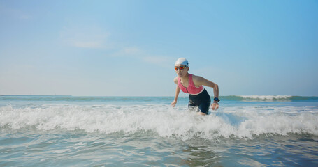 woman training triathlon at beach