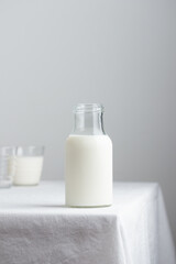 Fototapeta na wymiar Fresh Milk on the table with white tablecloth