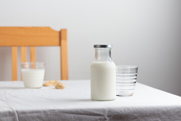 Fototapeta na wymiar Fresh Milk on the table with white tablecloth