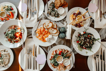 Served table in a restaurant with various snacks close-up
