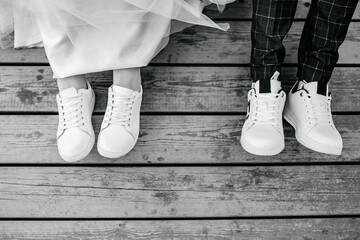White sneakers on the bride and groom close-up