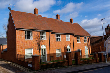 Woodbridge Suffolk UK February 16 2022: A row of 3 newly built town houses in the center of a busy...