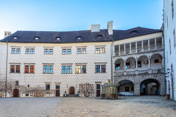 The historical castle complex in old town of Jindrichuv Hradec city. View of courtyard with a fountain. It is the third largest castle complex in the Czech Republic