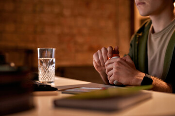 Male trader opening jar with medicine pills