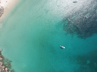 Phuket beach sea. Landscape view of beach sea and sand in summer sun. Beach space area background. At Naiharn beach, Phuket, Thailand.