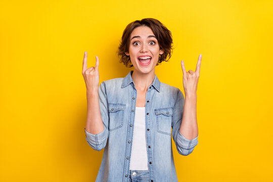 Photo Of Young Careless Excited Woman Show Harsh Metal Symbol Childish Isolated Over Yellow Color Background