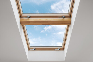 Energy efficient attic window in wooden frame - Powered by Adobe