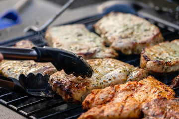 gas grill with grilled meat grill tongs 