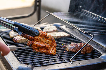 gas grill with grilled meat grill tongs 