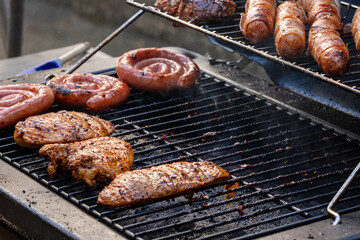 gas grill with grilled meat