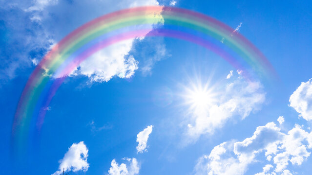 Panorama background of rainbow-covered blue sky and sun_07