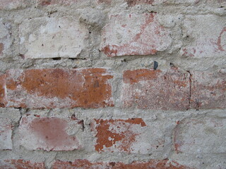 Brick masonry freed from plaster, unplastered house brick wall without wall plastering