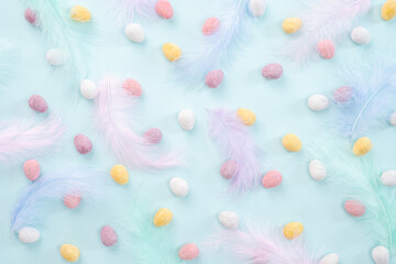 Happy Easter concept. Beautiful greeting card. Preparation for holiday. Easter candy chocolate eggs on trendy pastel blue background. Simple minimalism flat lay top view copy space